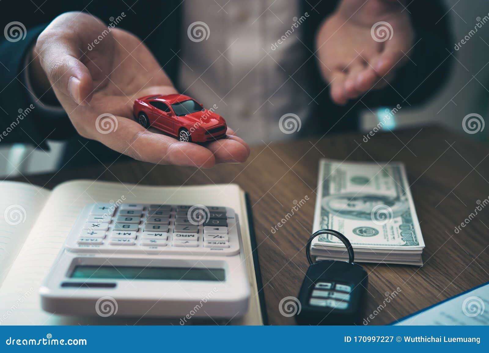 sales car agent explains about the contract to buy a new car to the customer and the payment of installments