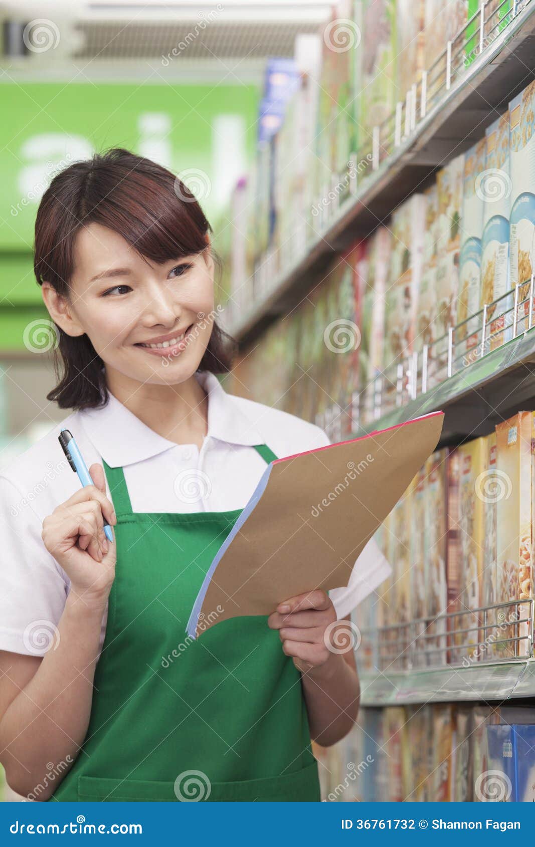 Sales Clerk Checking Groceries in Supermarket Stock Photo Image of