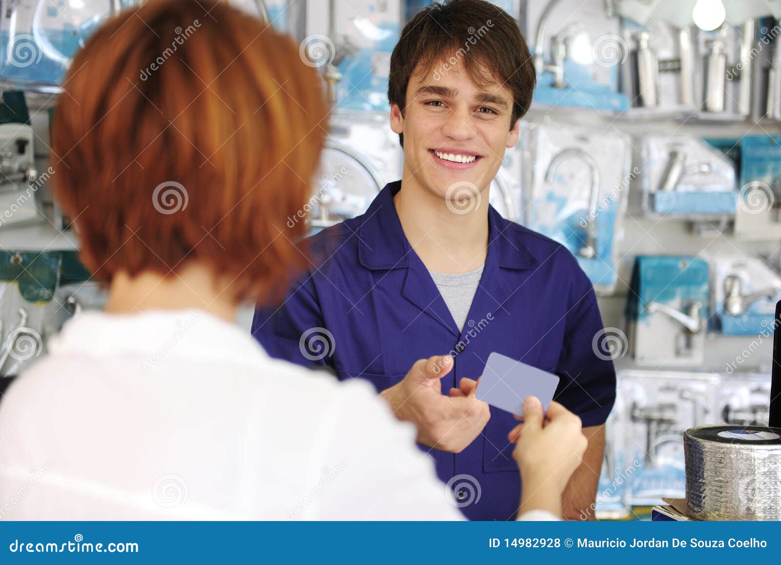 sales clerk receiving credit card