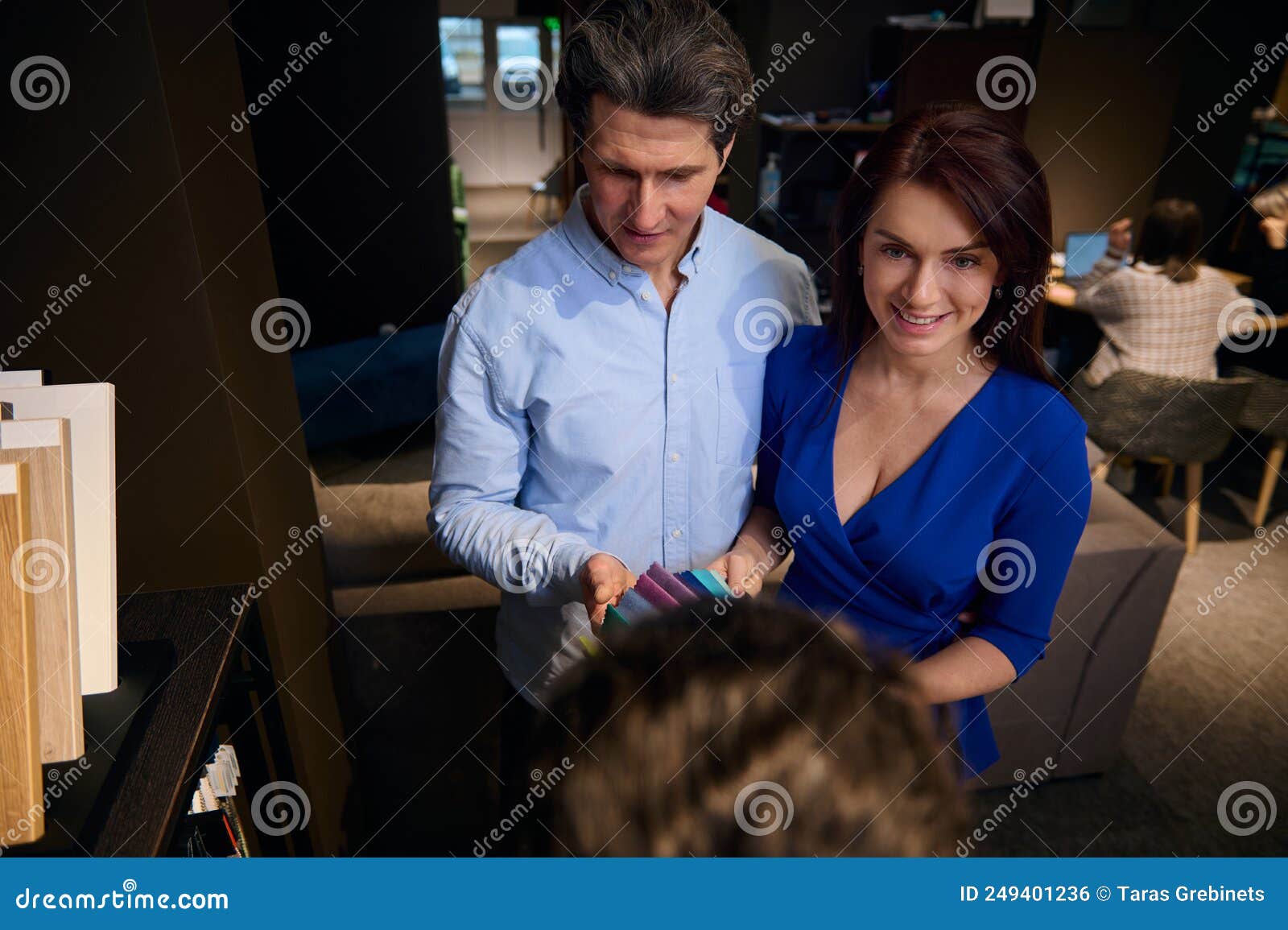 Sales Manager Interior Designer Demonstrates Colorful Samples of