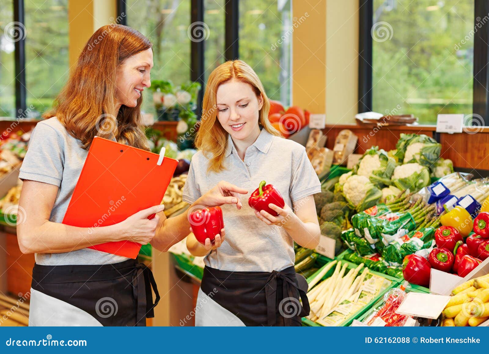 Salesclerk in Training Getting Help from Staff Stock Photo Image of