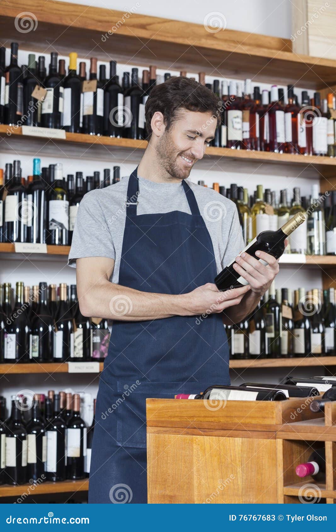 Salesman Reading Label of Wine Bottle in Store Stock Image Image of
