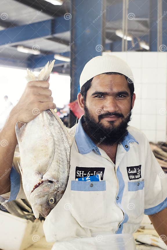 Salesman Showing His Fresh Fish, Dubai, United Arab Emirates Editorial Photography Image of