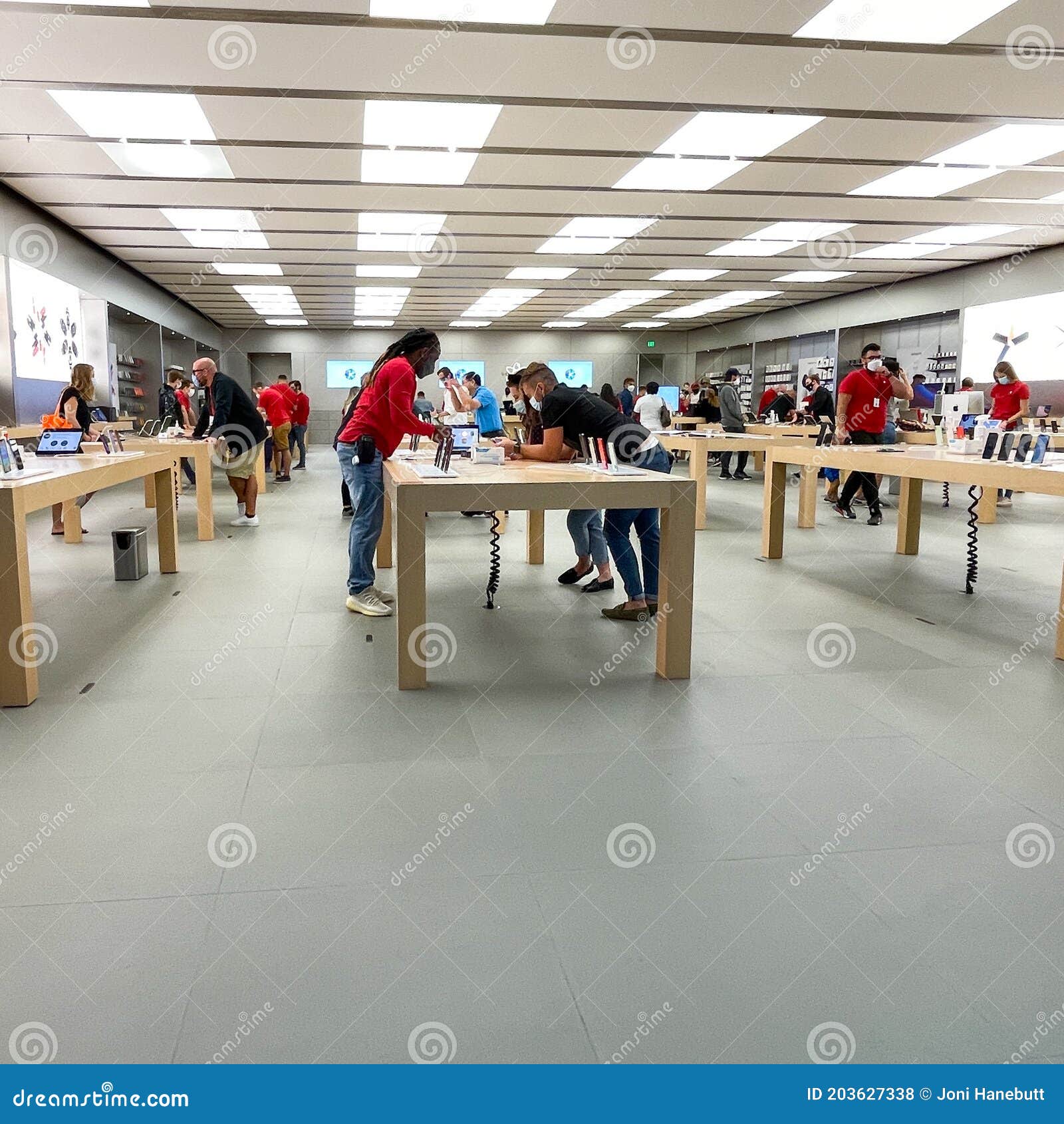 Salespeople and Customers at an Apple Store Looking at the Latest Apple  Products for Sale Editorial Stock Photo - Image of american, international:  203627338