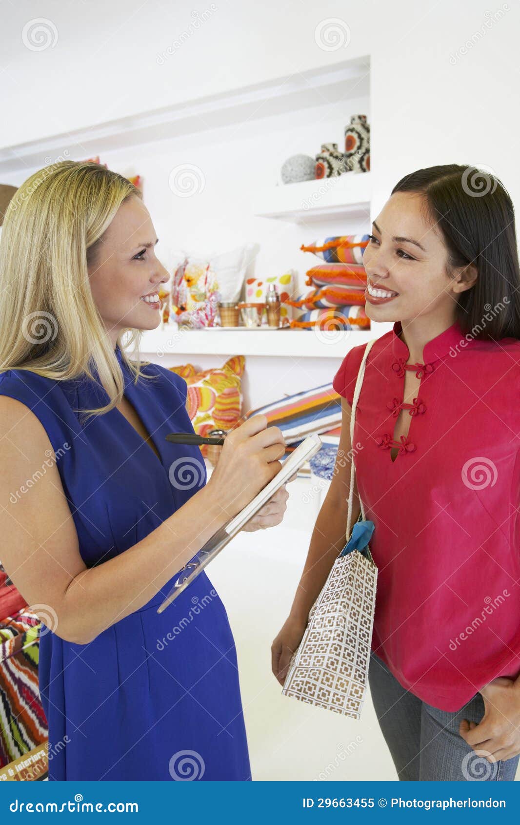 saleswoman communicating with female customer in store