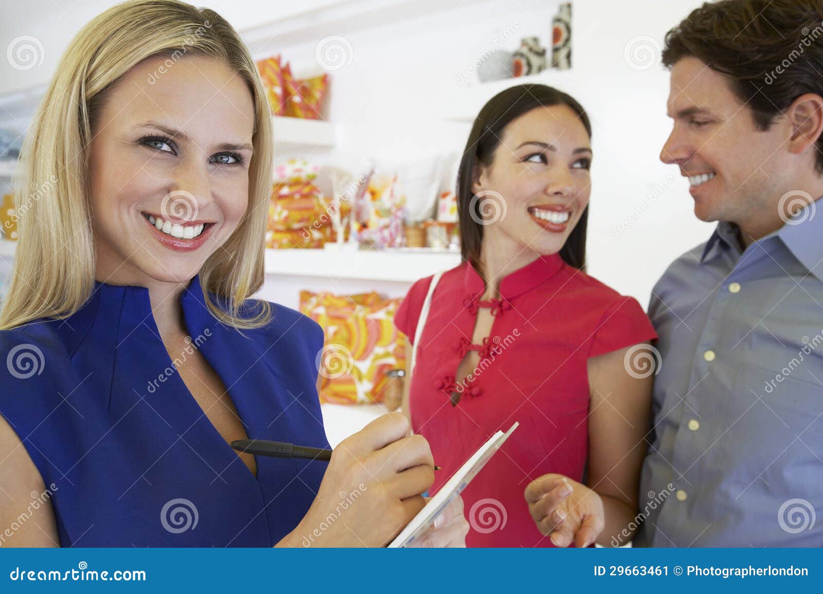 saleswoman and couple at store