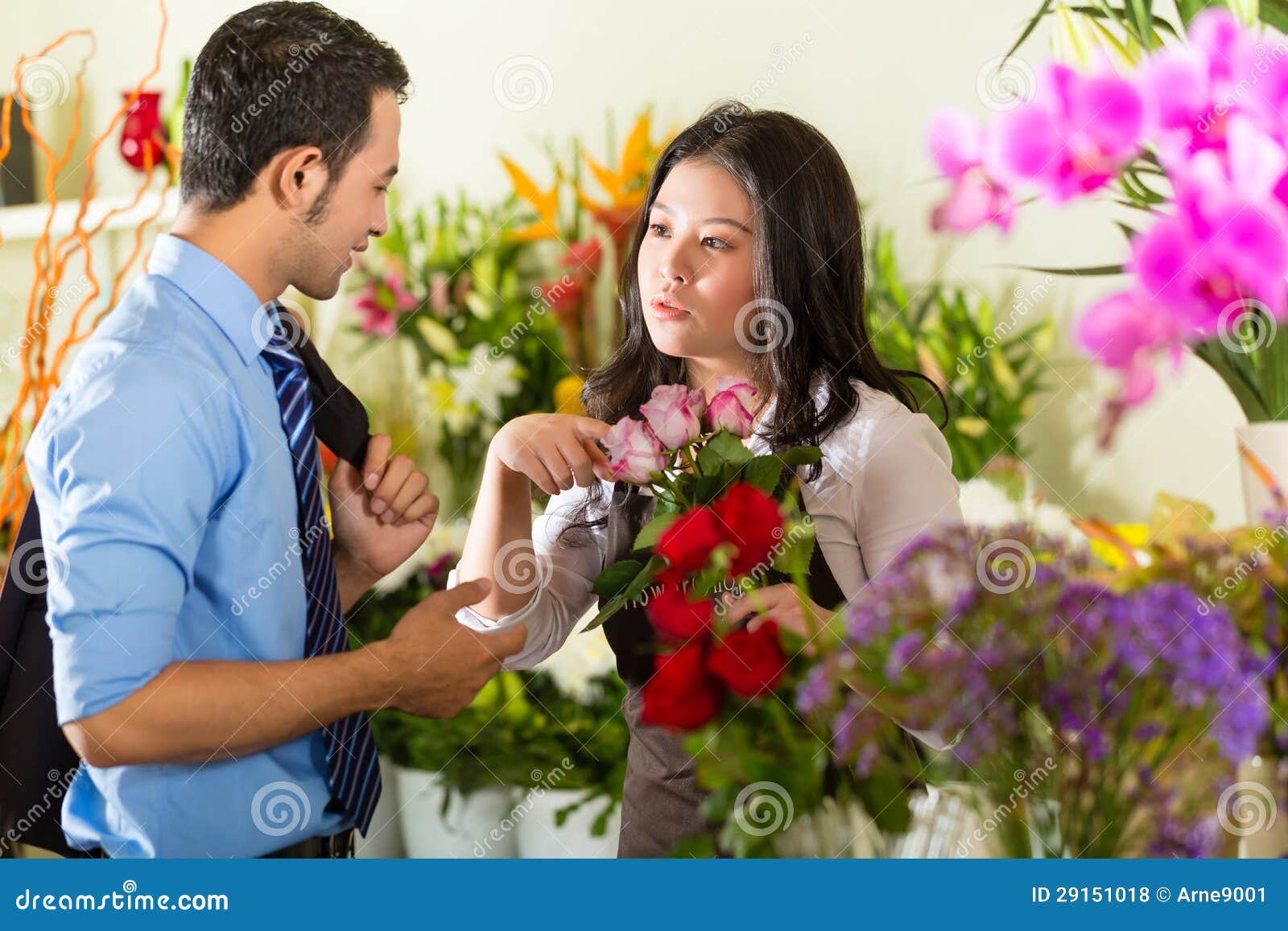saleswoman and customer in flower shop