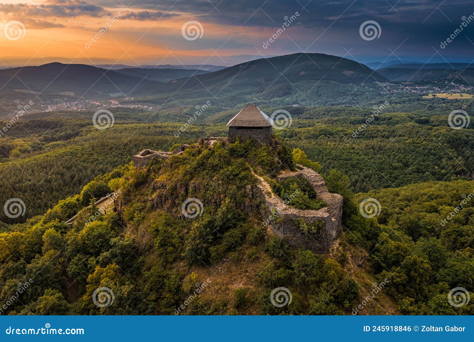 salgotarjan, hungary - aerial view of salgo castle salgo vara in nograd county with dark storm clouds and golden sunset