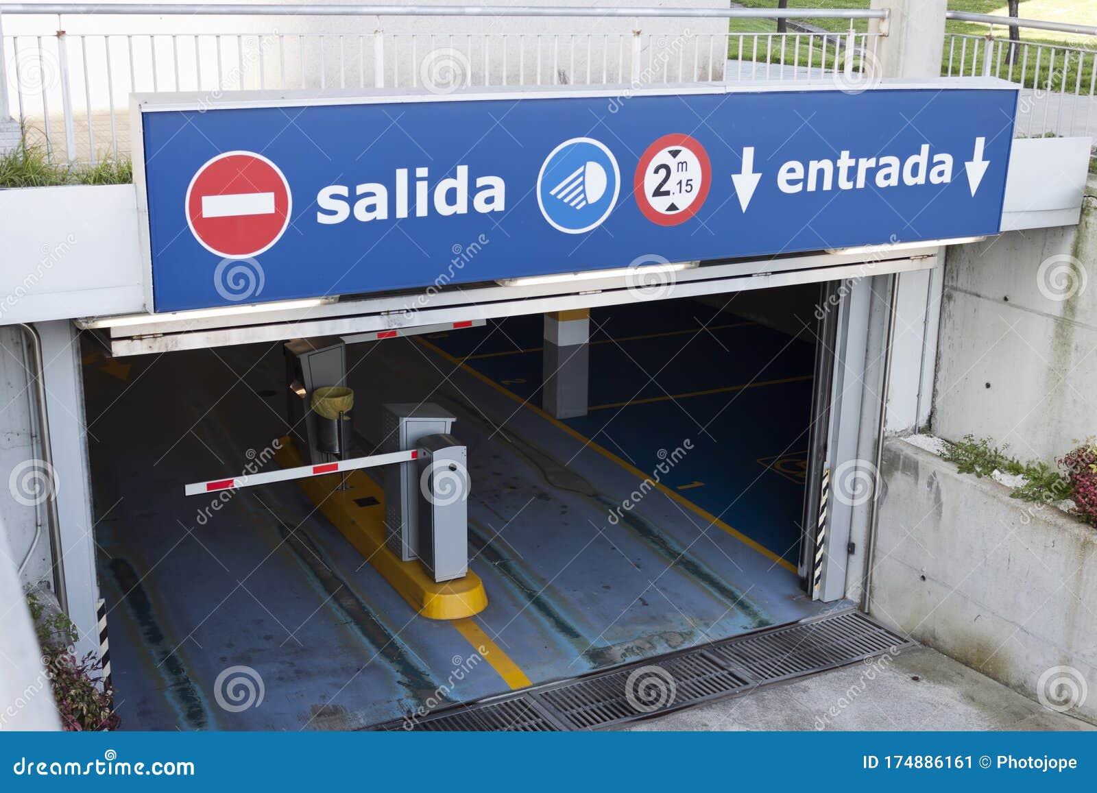 salida, entrada sign at underground parking entrance. exit, entry in spanish