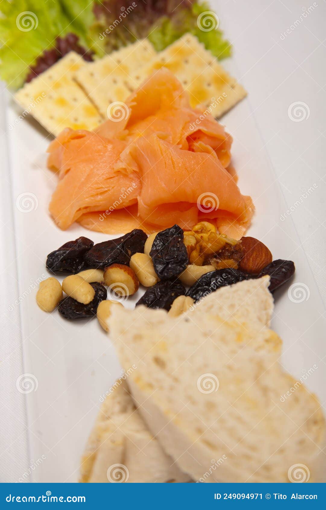 salmon appetizer and bread, almonds