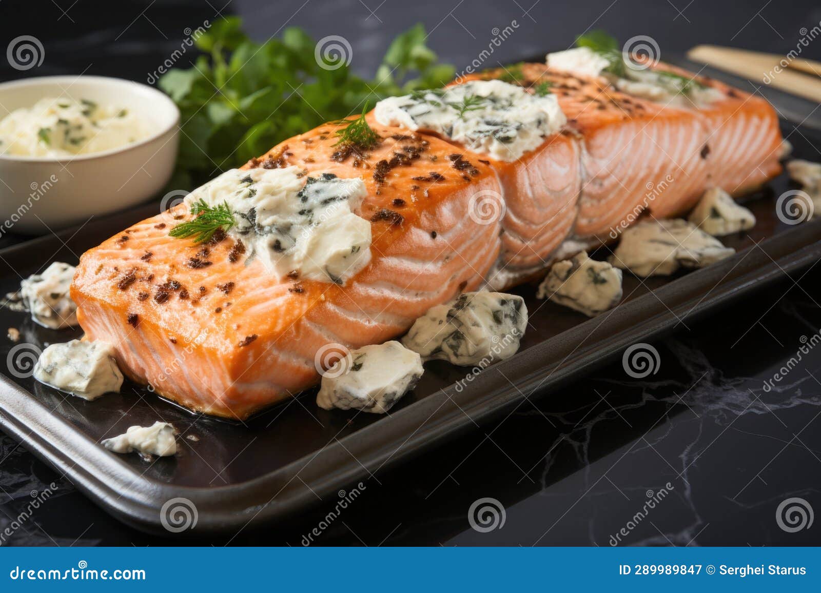 Salmon with Blue Cheese and Herbs on a Black Plate, AI Stock Image