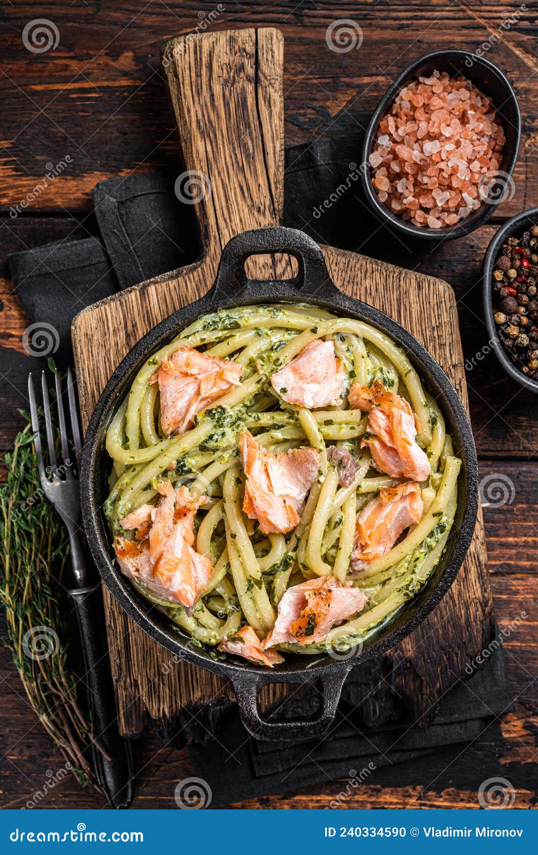 Salmon Bucatini Pasta with Creamy Spinach Sauce and Fish Fillet. Wooden ...
