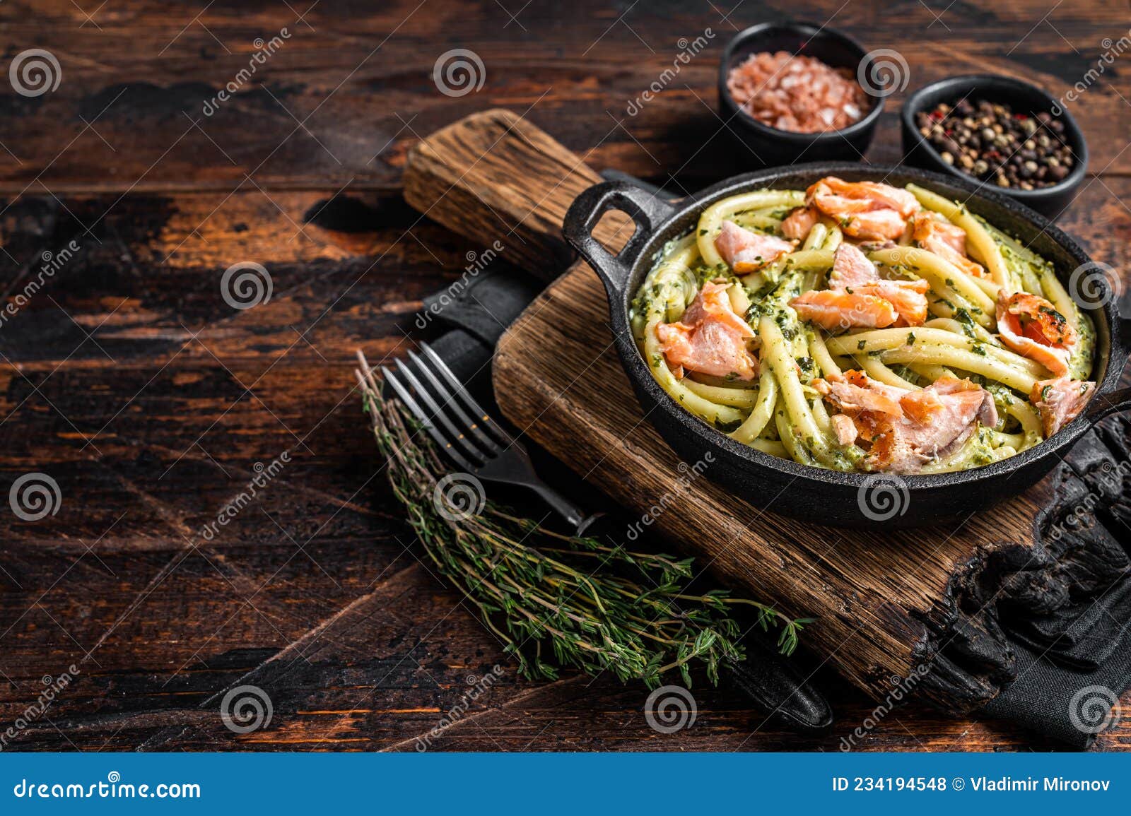 Salmon Bucatini Pasta with Creamy Spinach Sauce and Fish Fillet. Wooden ...