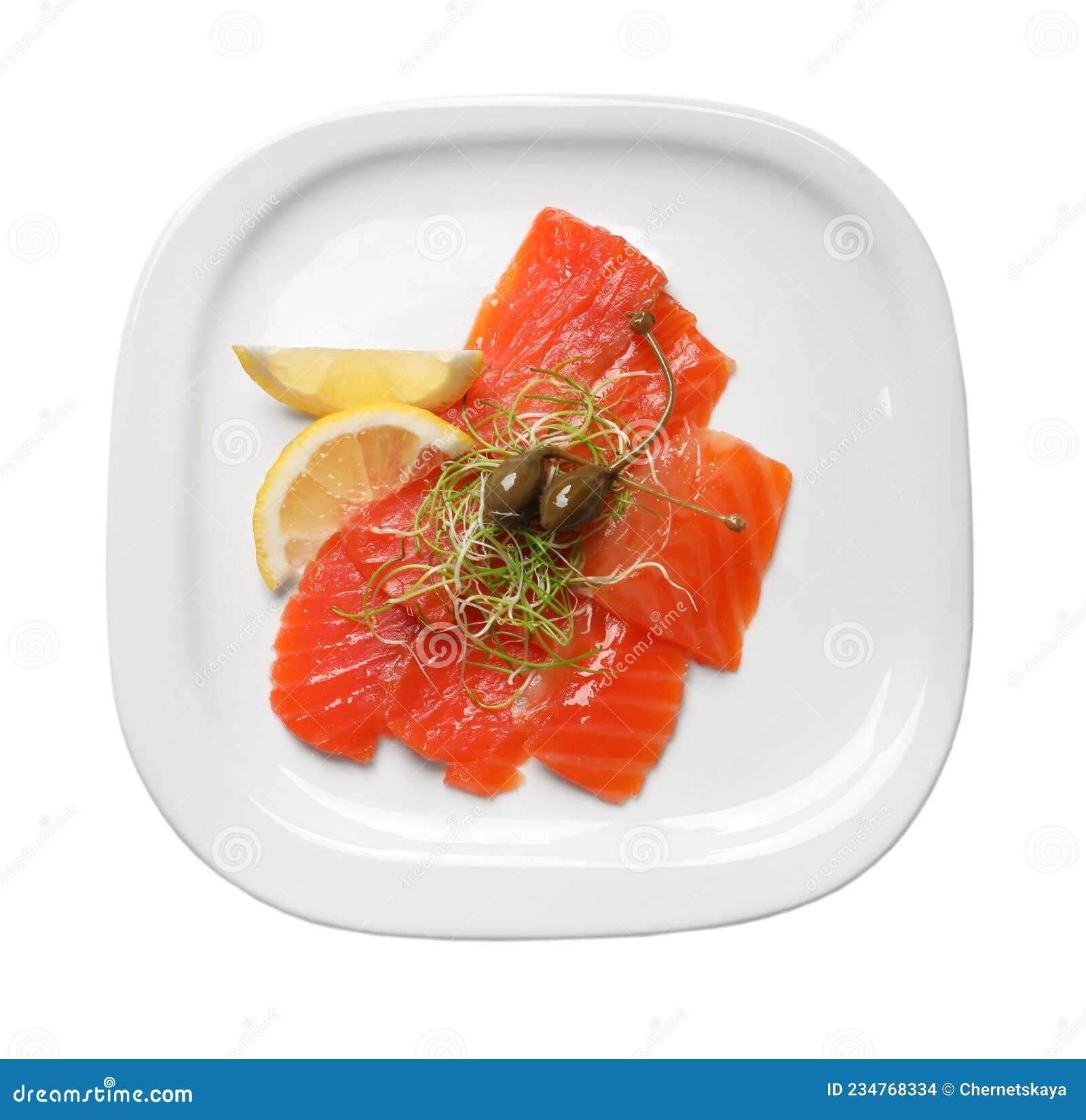 Salmon Carpaccio with Capers, Microgreens and Lemon Isolated on White
