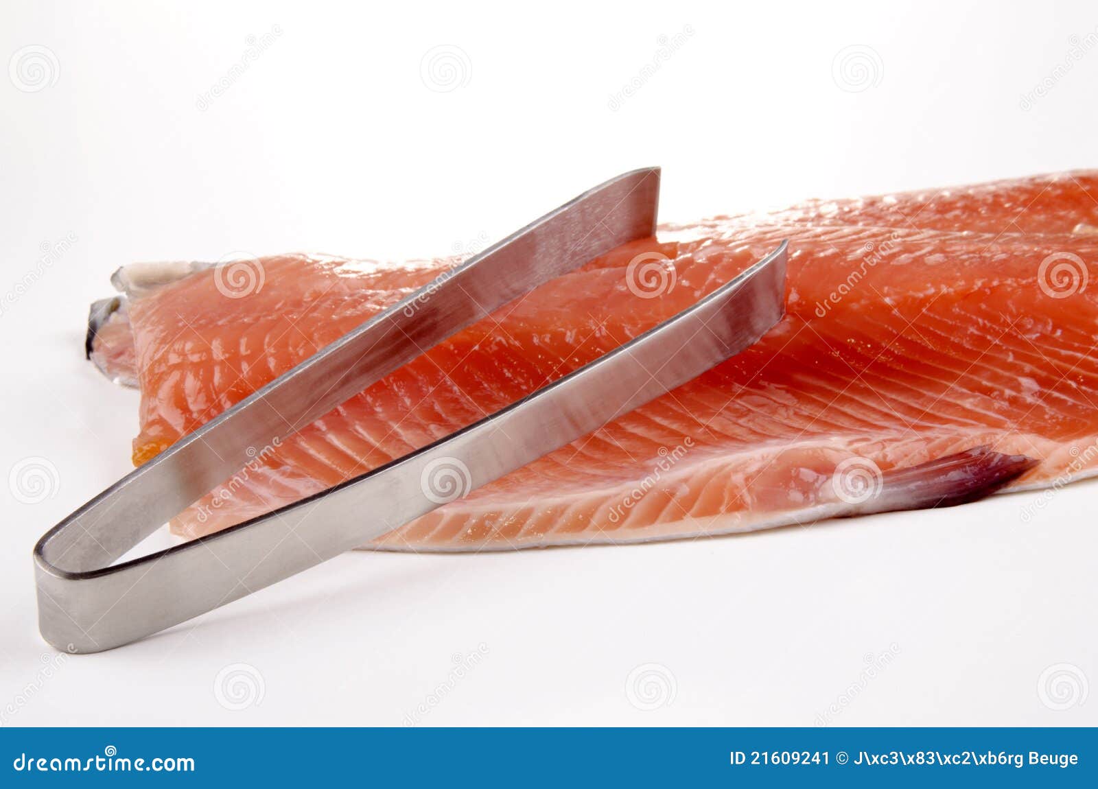 salmon fillet and a fish bone tong
