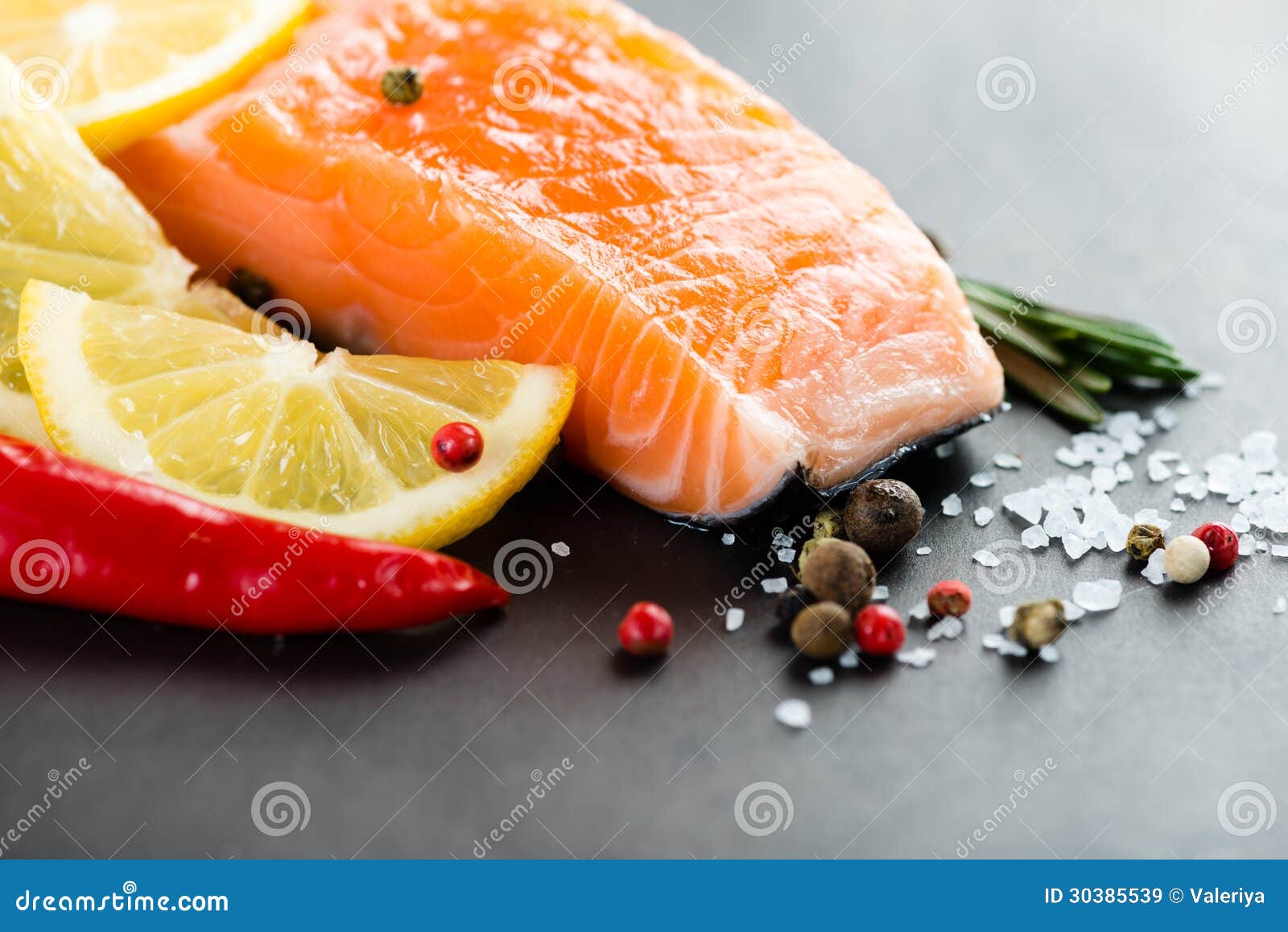 Salmon fillet with lemon stock image. Image of lemon 30385539