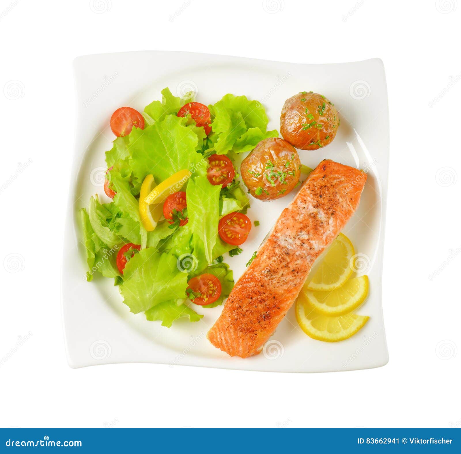 Salmon Fillet with Roasted Potatoes and Fresh Vegetables Stock Image