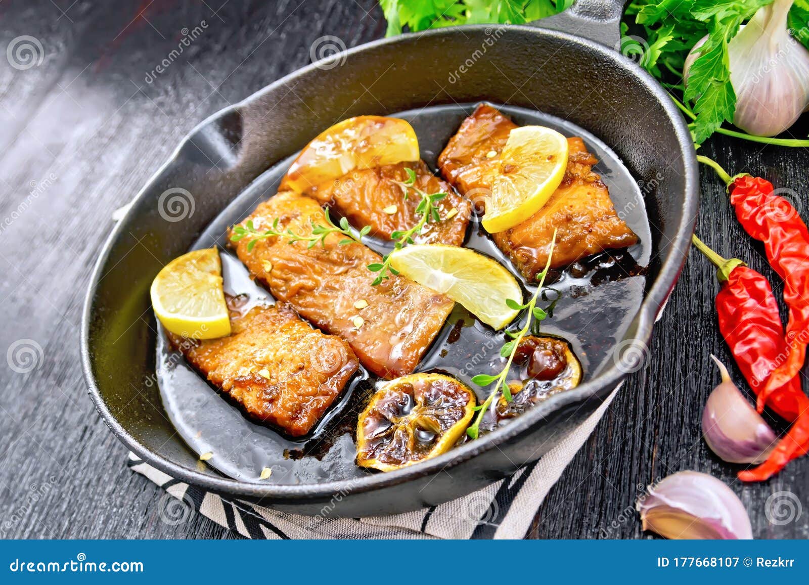 Salmon with Sauce in Pan on Dark Board Stock Image - Image of food ...