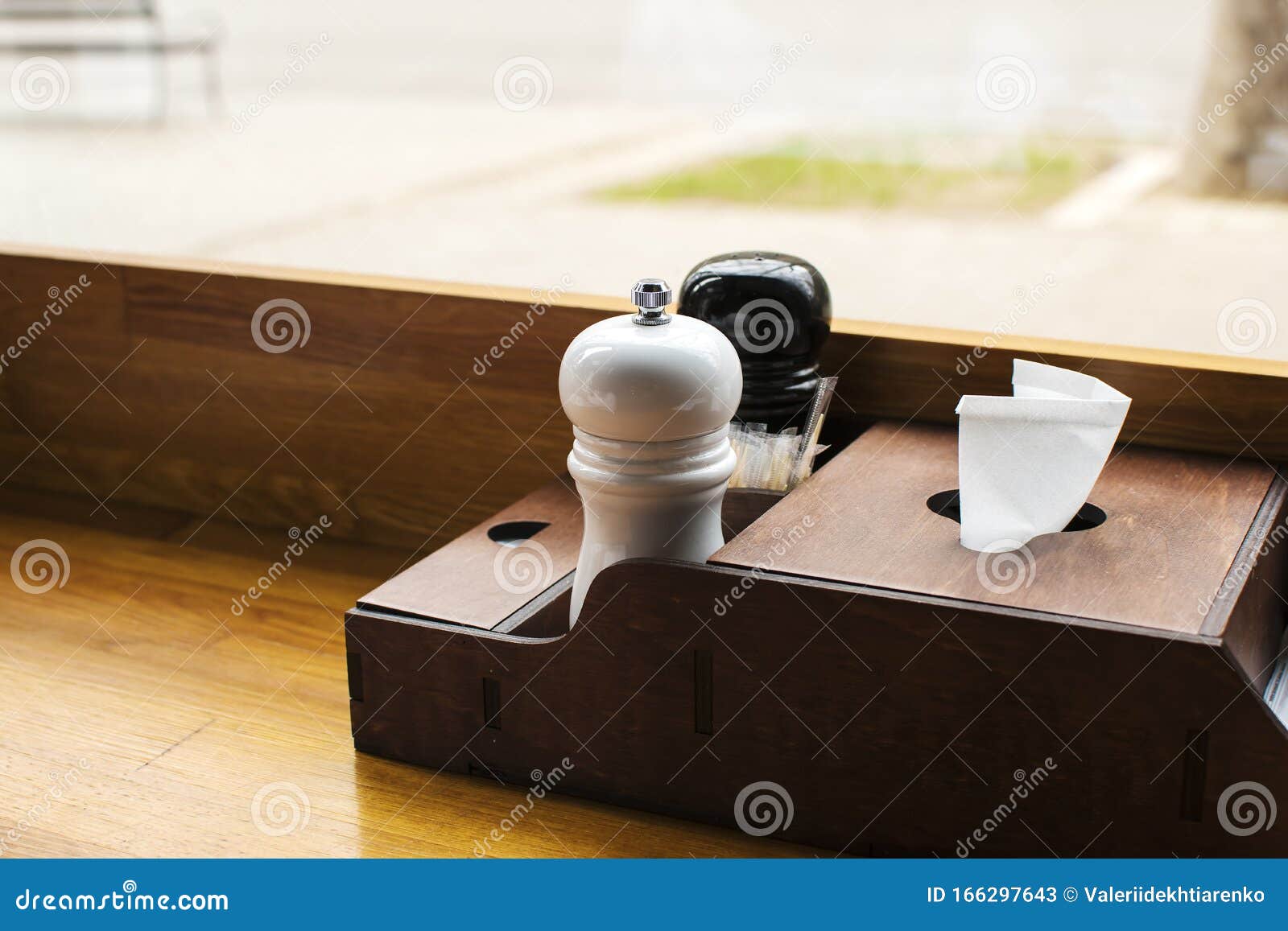 Salt and Black Pepper Shakers on Table Stock Image Image of