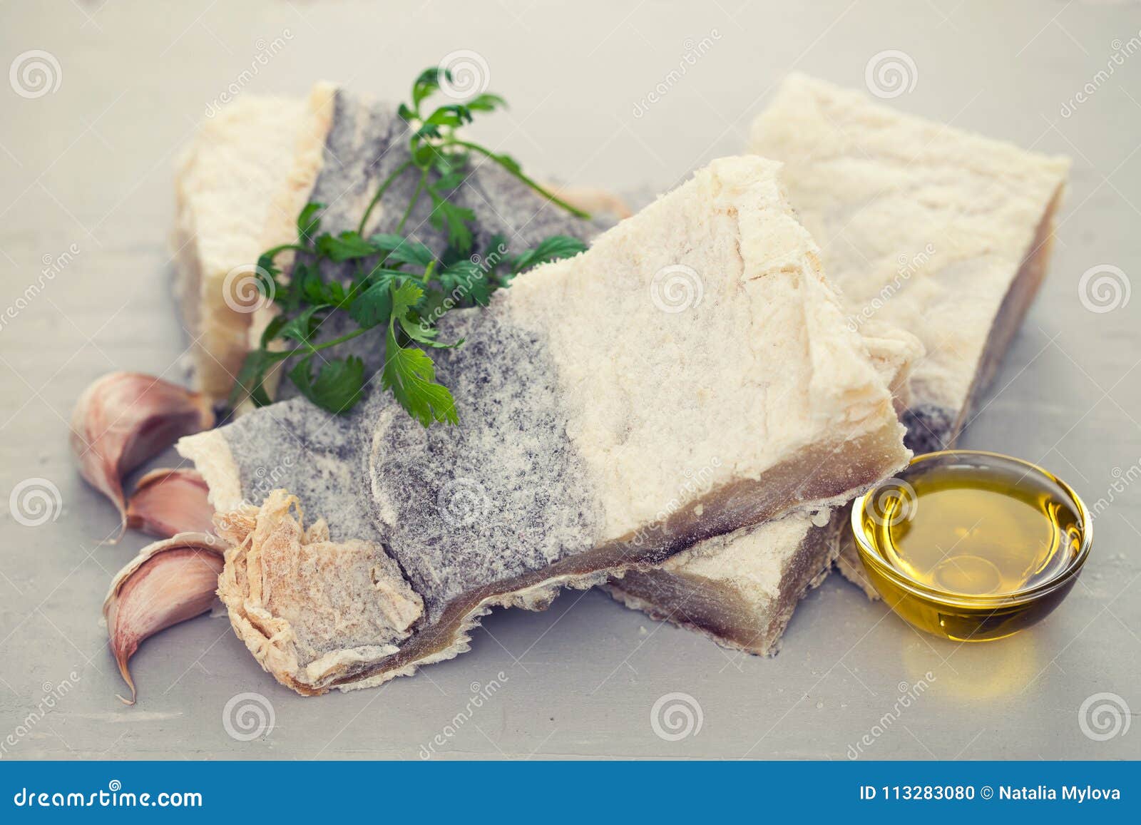 Salted cod fish with herbs stock photo. Image of fillet 113283080