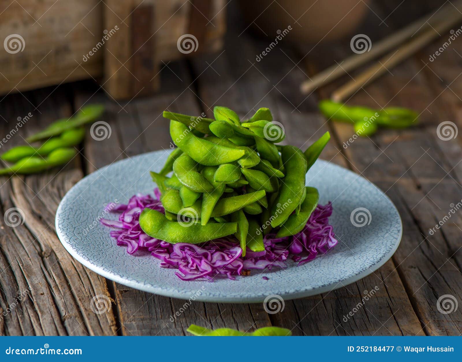 SALTED EDAMAME Served in a Dish Isolated on Wooden Background Side View