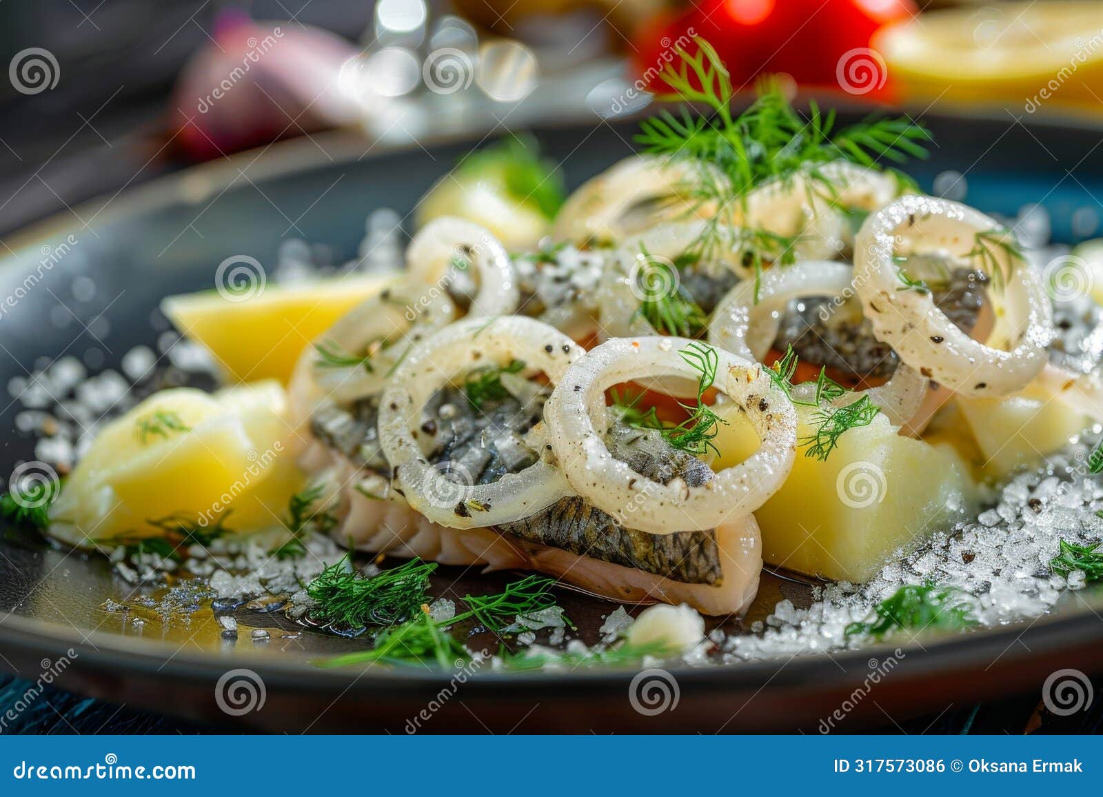 salted soused herring, raw marinated fish fillet, onion rings and boiled diced potato