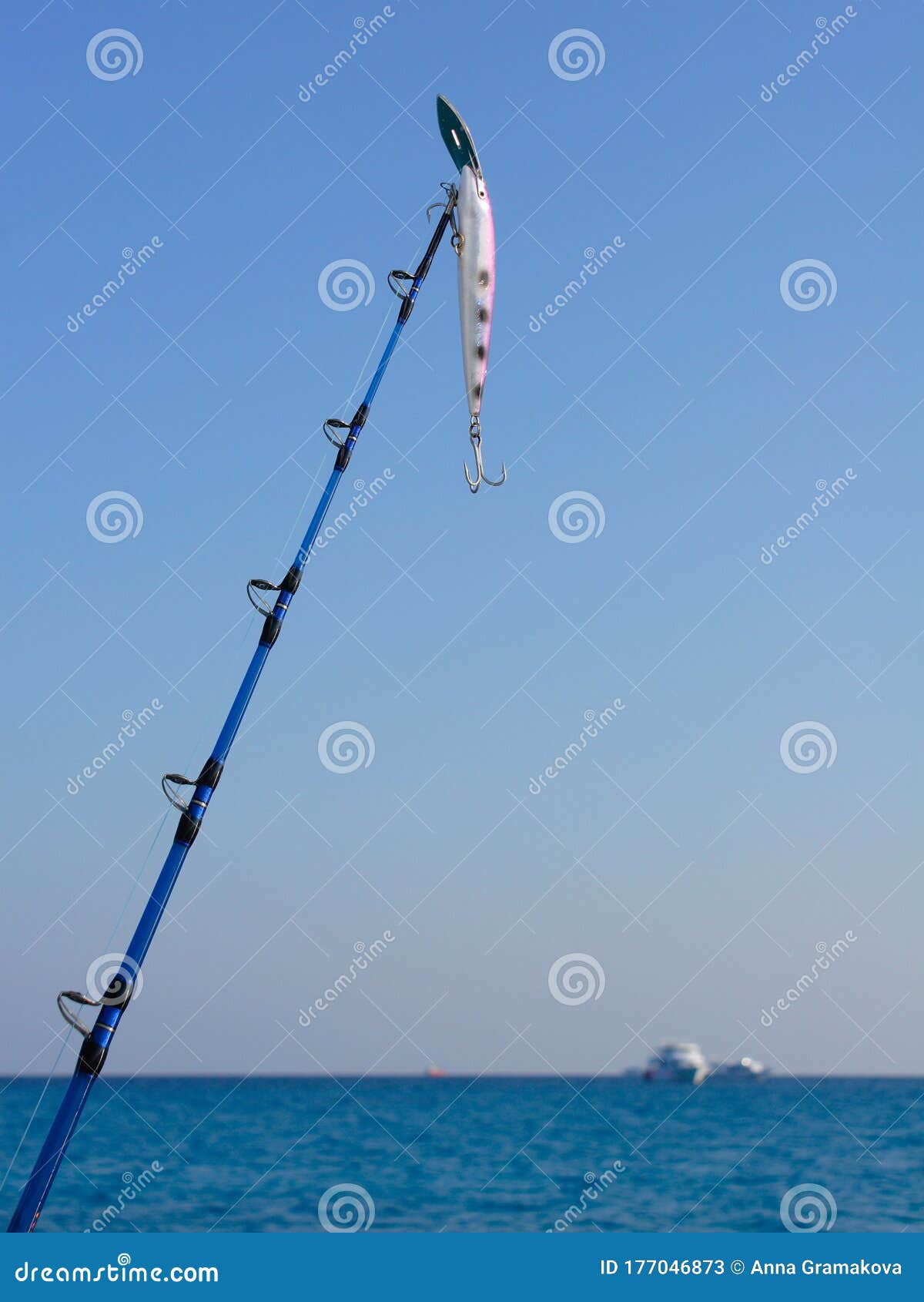 https://thumbs.dreamstime.com/z/saltwater-fishing-fishing-rod-spinning-rod-wobbler-saltwater-fishing-fishing-rod-spinning-rod-wobbler-blue-background-177046873.jpg