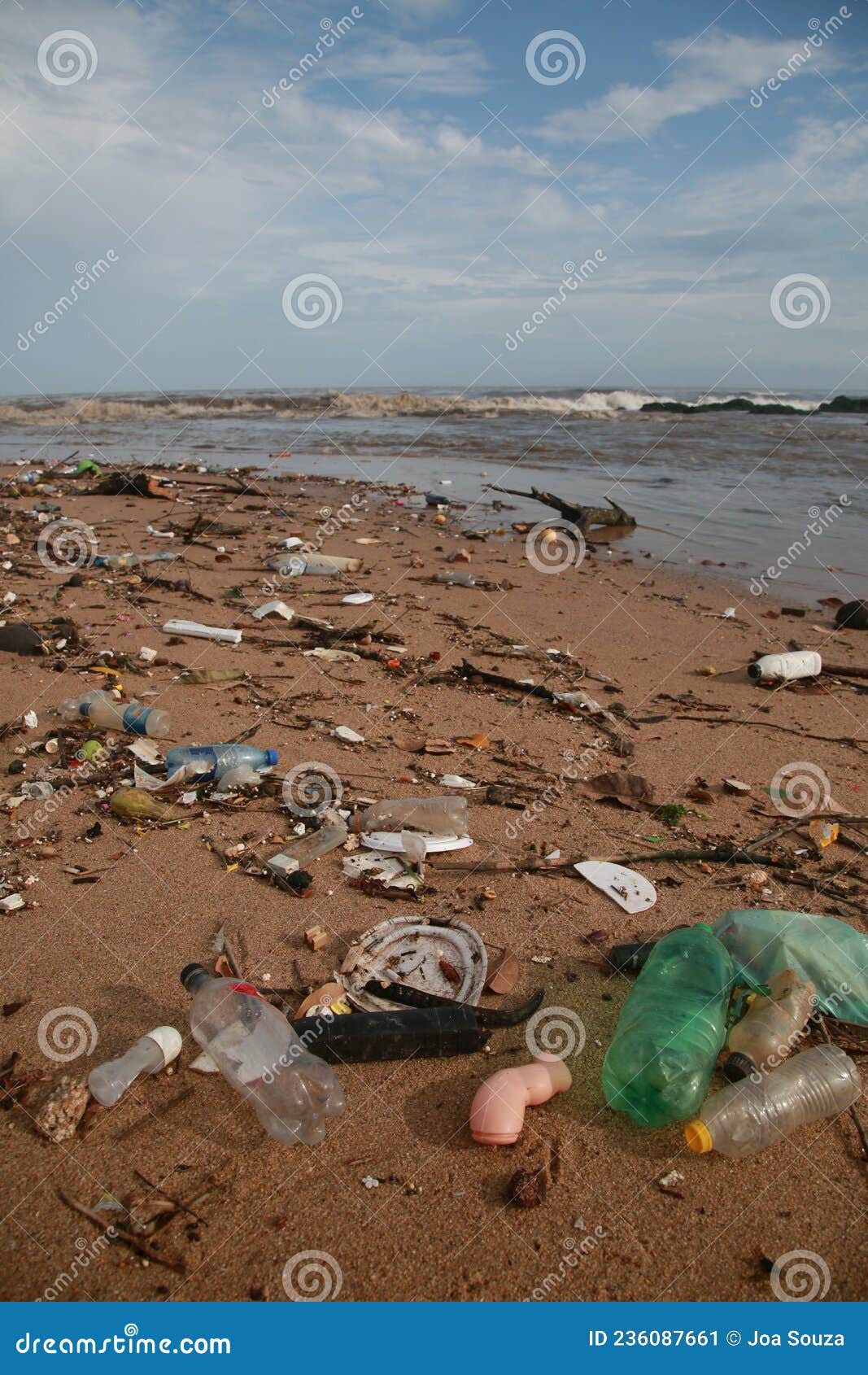 plastic and garbage on the beach sand