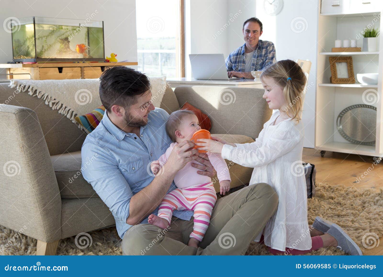 Same Sex Couple at Home with Daughters Stock Image pic pic