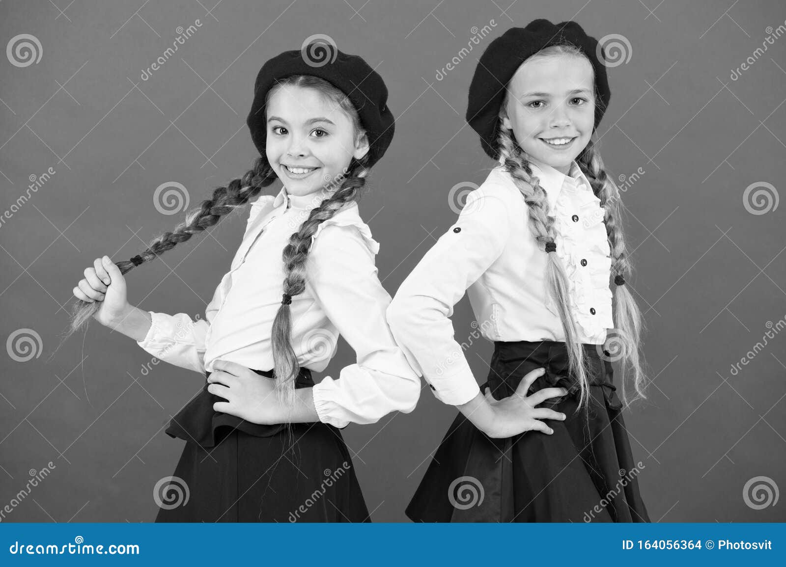 On Same Wave. Schoolgirls Wear Formal School Uniform. Children ...
