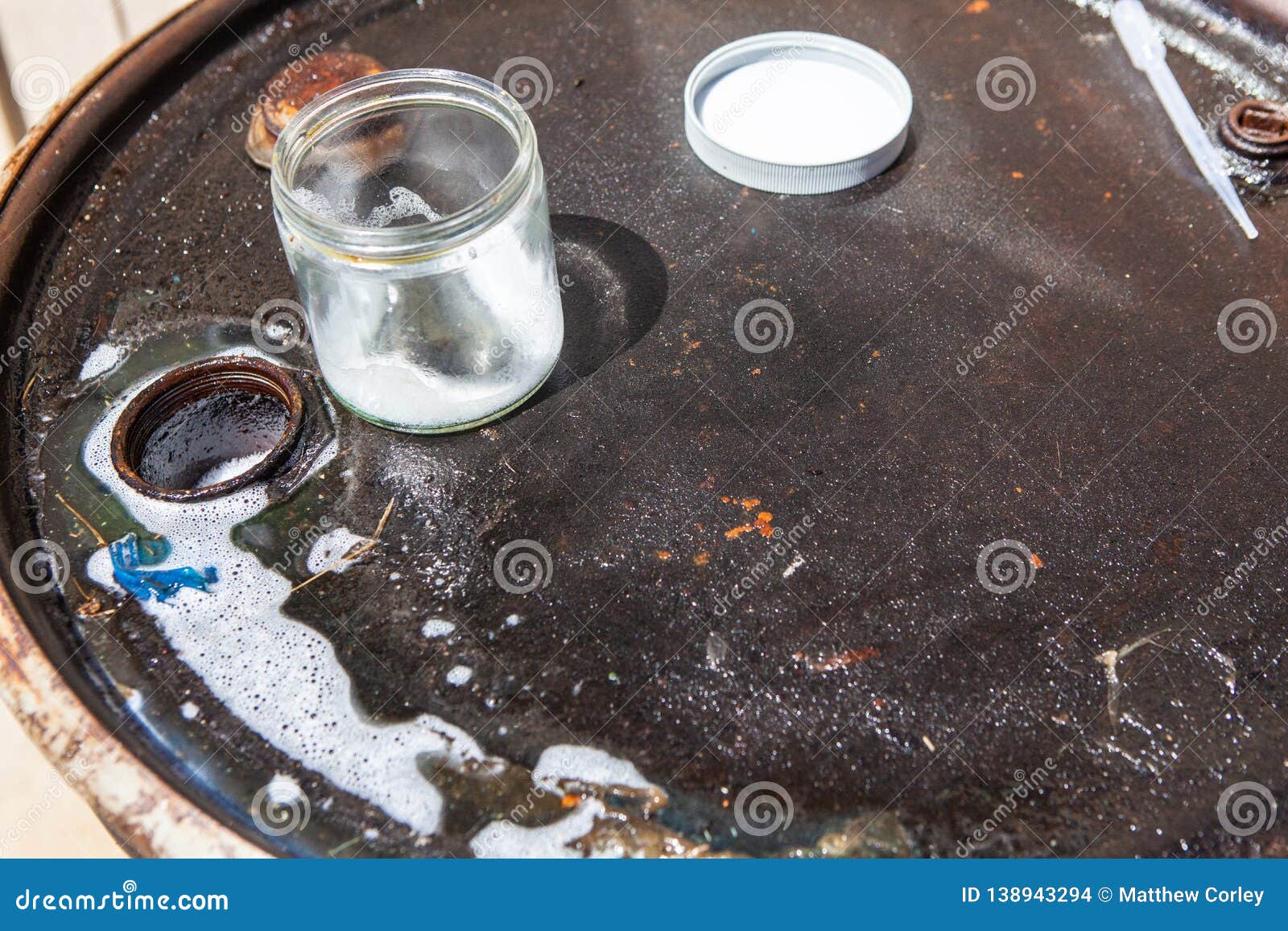 Sample Collection from Steel Drum Stock Photo Image of liquid