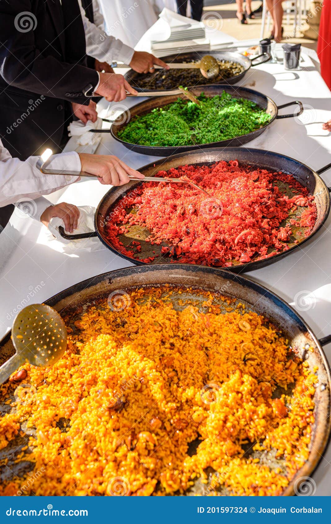 sample and tasting of various types of valencian paellas, a traditional spanish dish for tourists