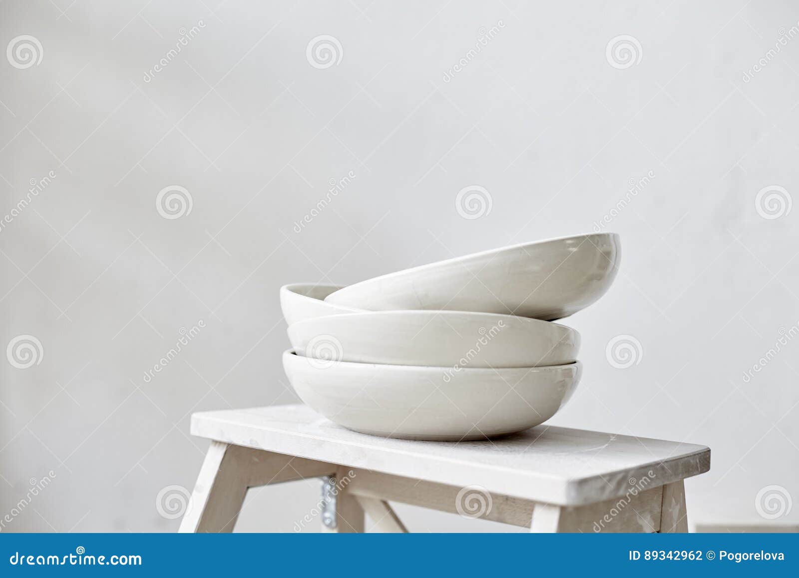 Samples Handmade Ceramic White Plates on Wooden Table, Working Process in Studio Stock Photo