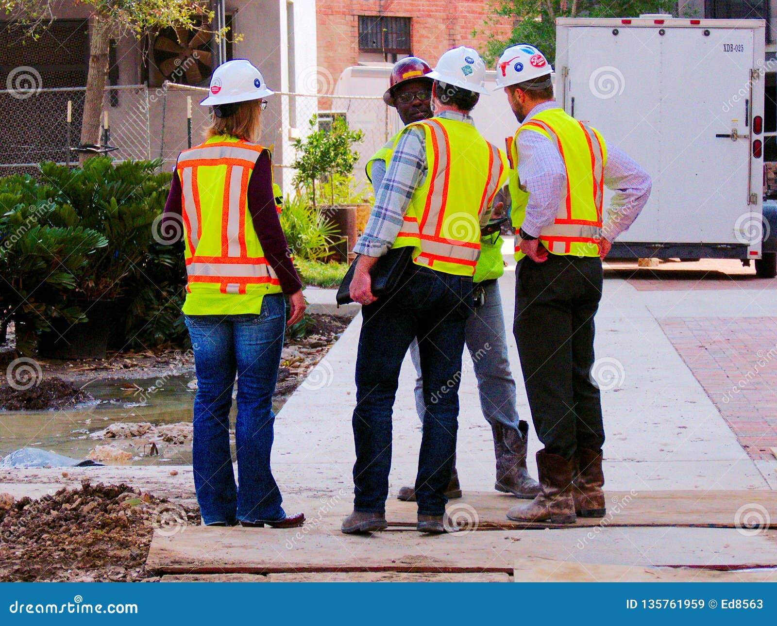 San Antonio, TX March 6, 2017 Construction Managers in Orange Work