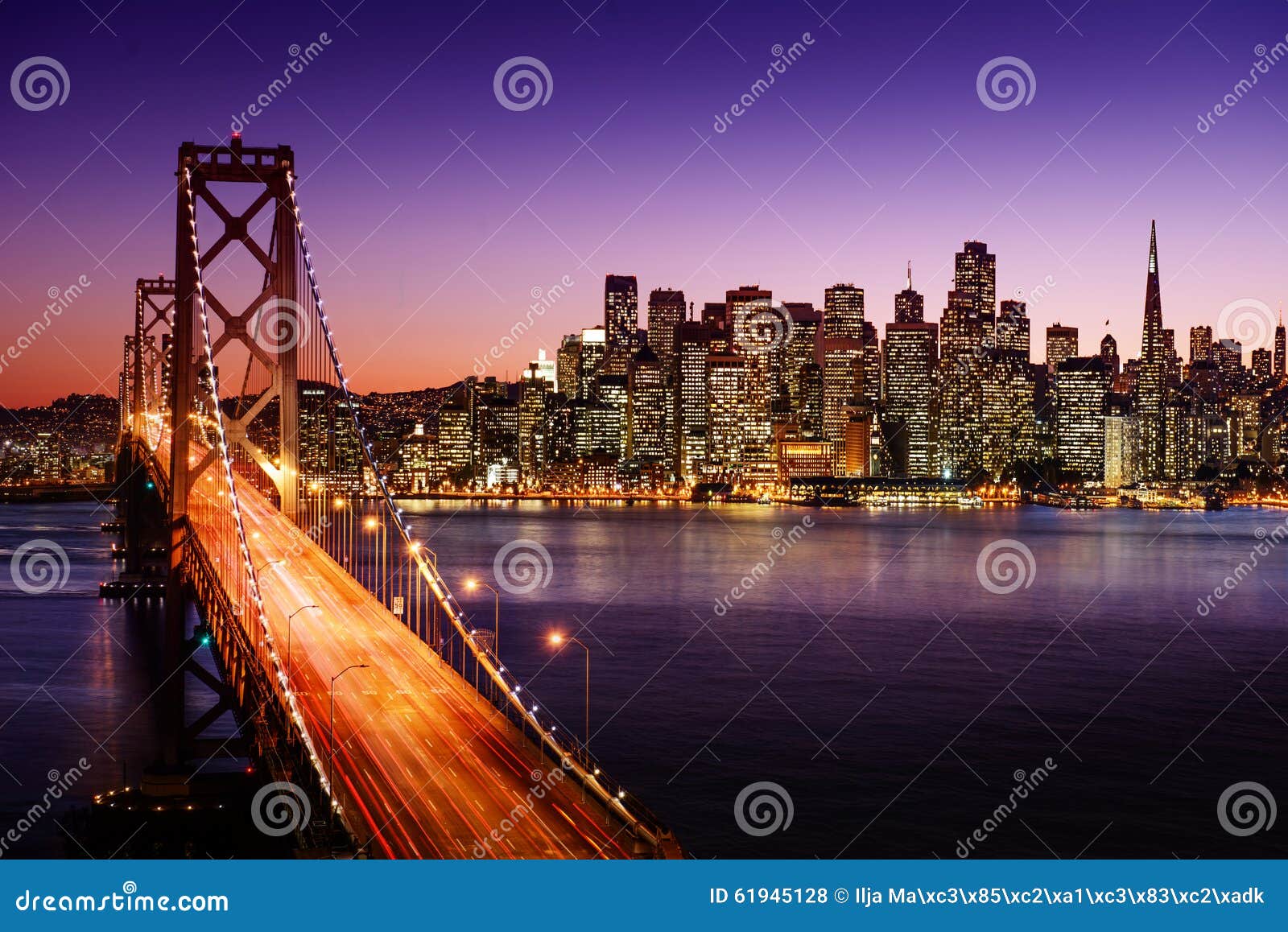 san francisco skyline and bay bridge at sunset, california