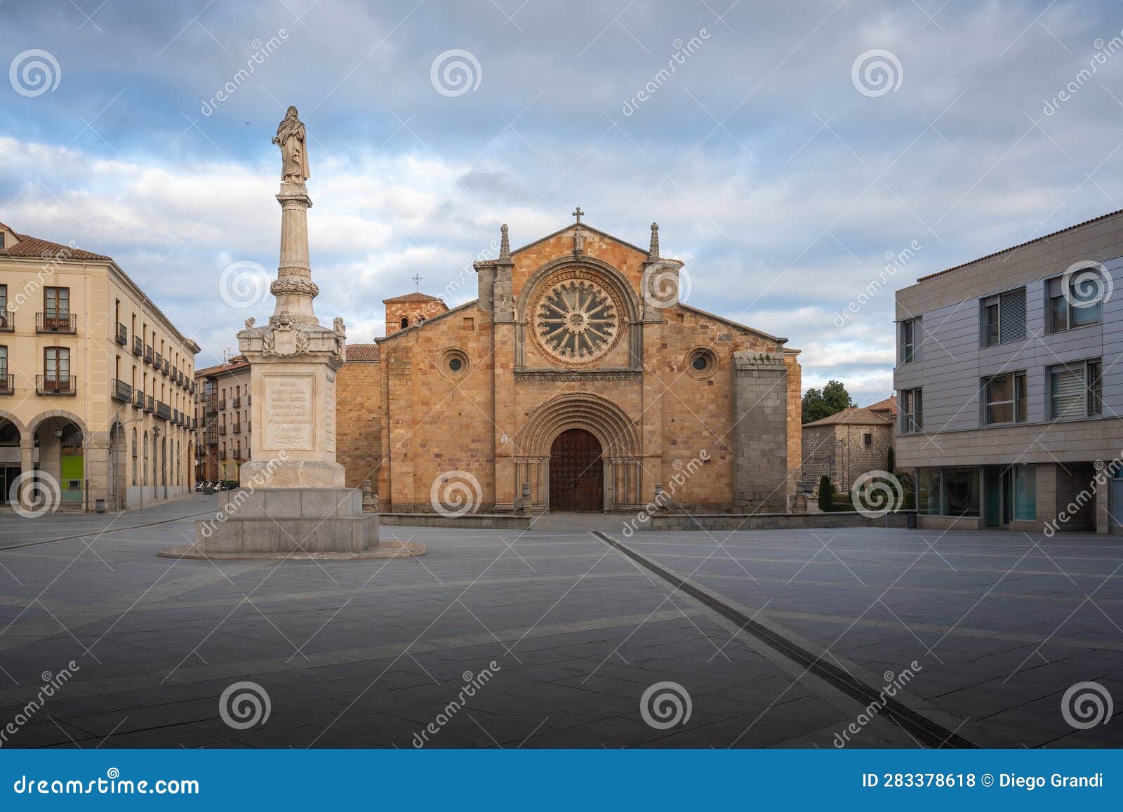san pedro church at plaza del mercado grande square with palomilla monument - avila, spain