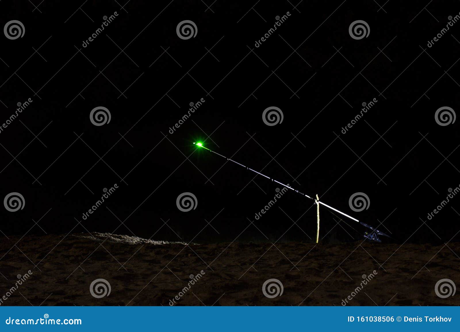 sanctifying fishing rods at night, the front and back background is blurred with bokeh effect