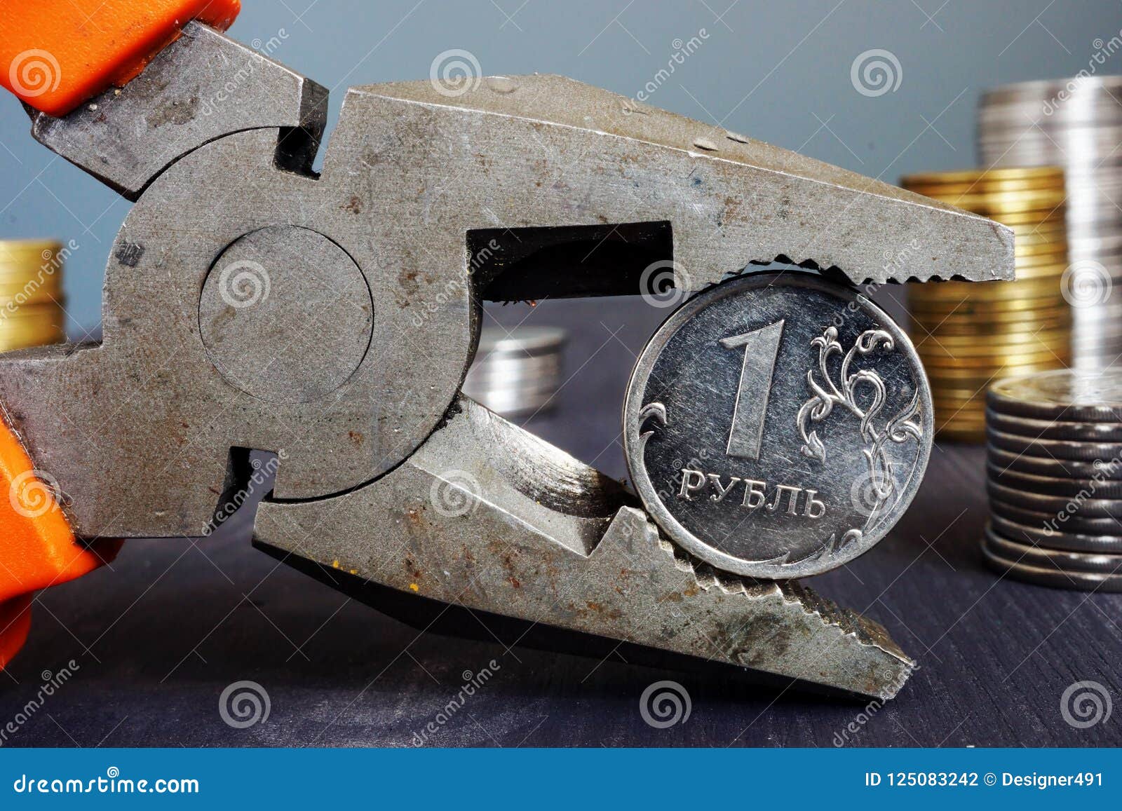 sanctions for russia and inflation. pliers holding russian ruble.