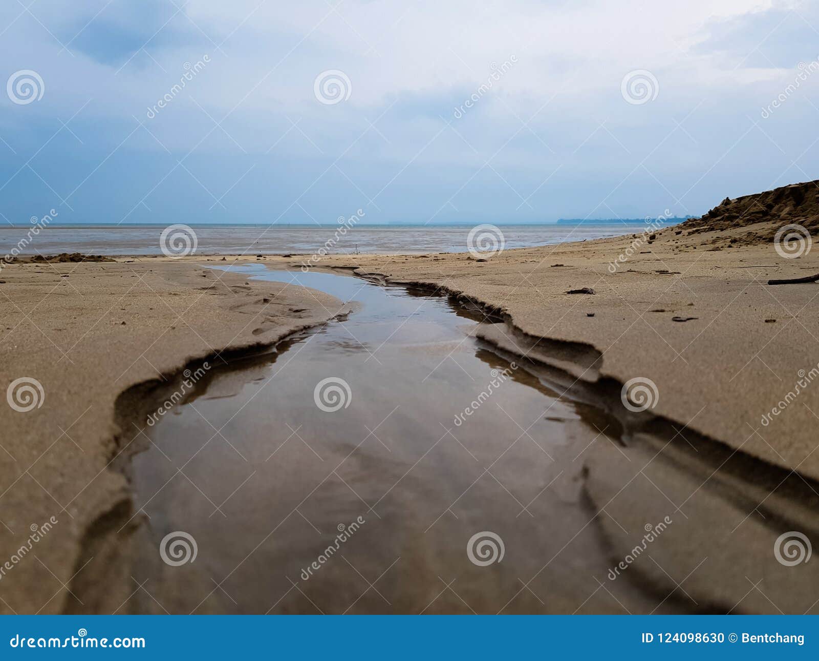 Sand Beach, with Rocks in Foreground. Stock Photo Image of cloud