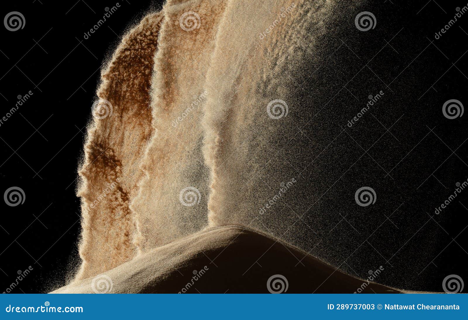 sand blow like galaxy star in space. sand dune hill over wind storm and blast dust splash over mountain. sunshine rain fall on