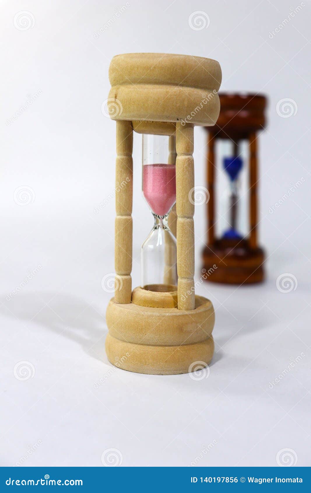 sand clock. we are all slaves of time. this can be good or bad, it just depends on your choices. feminist.white background