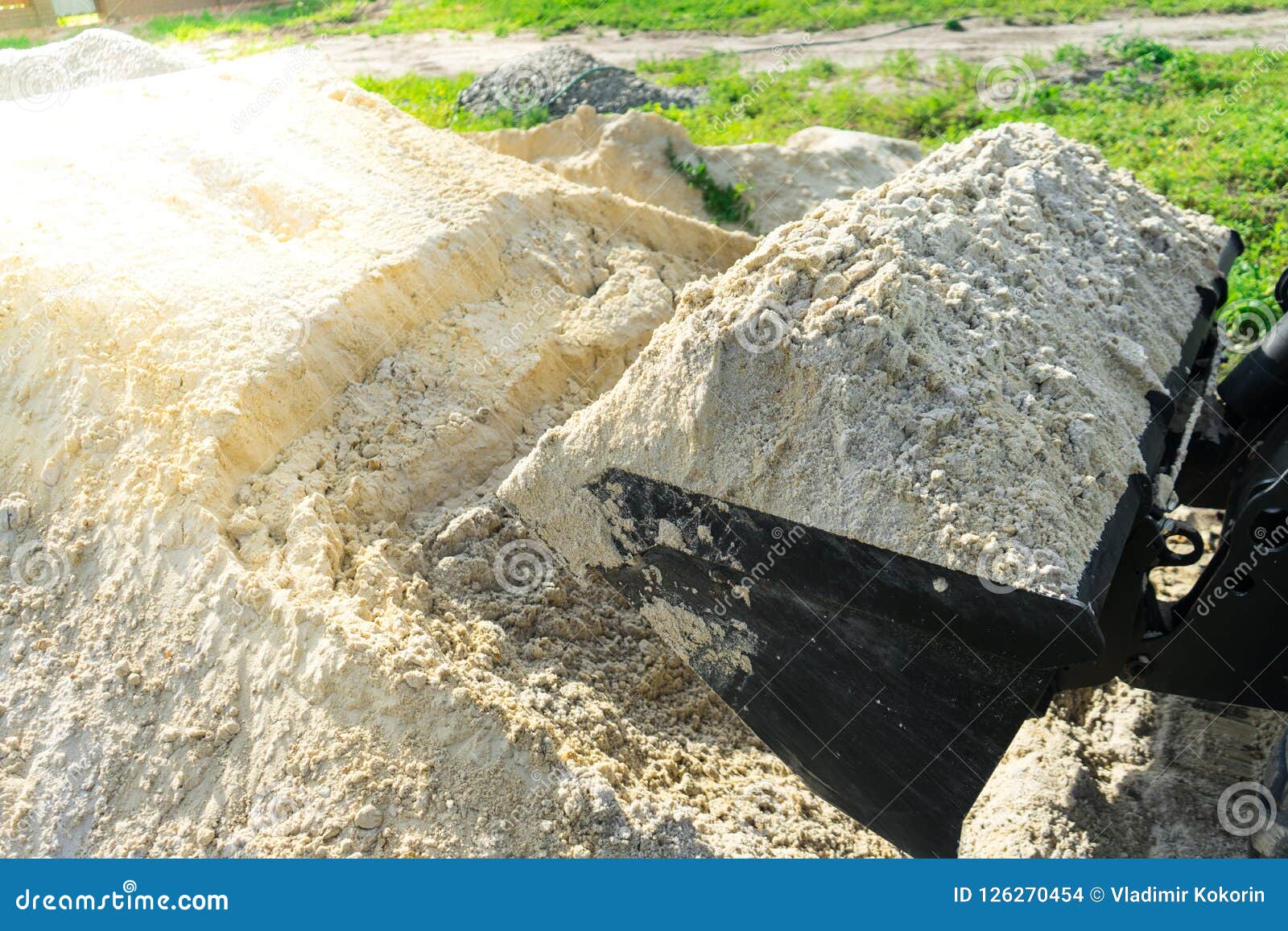 Sand for Construction Works is Collected in a Loader Bucket. Stock