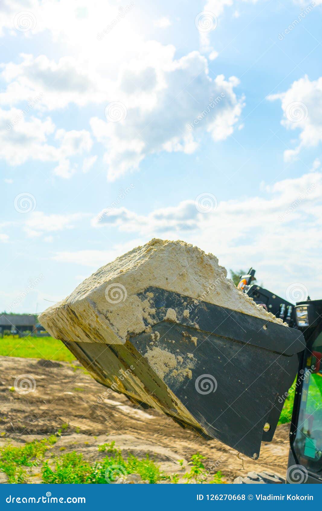 Sand for Construction Works is Collected in a Loader Bucket. Stock