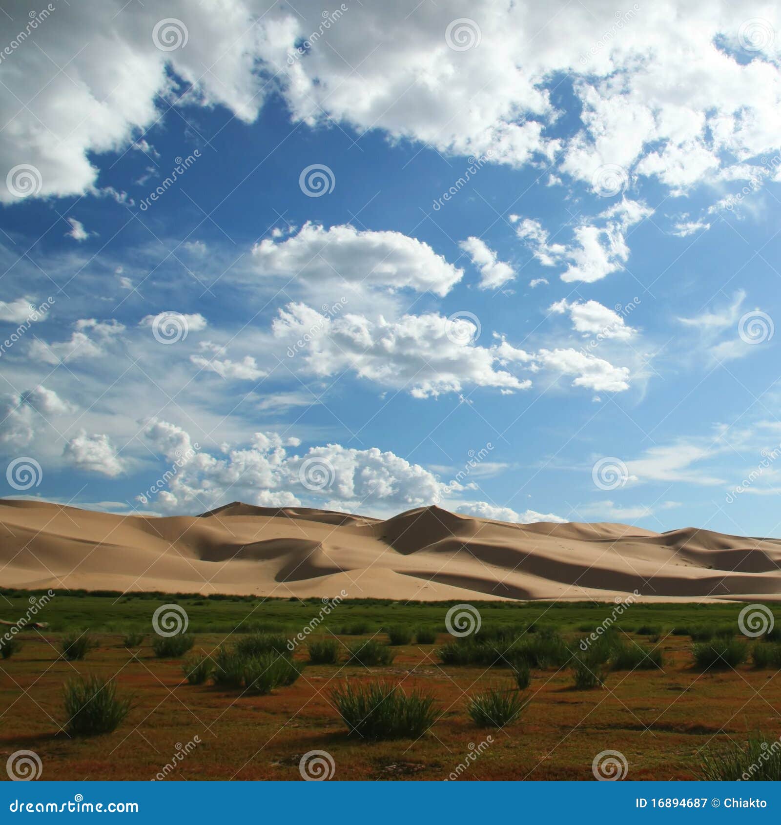 Clouds and sand dunes in gobi desert in mongolia