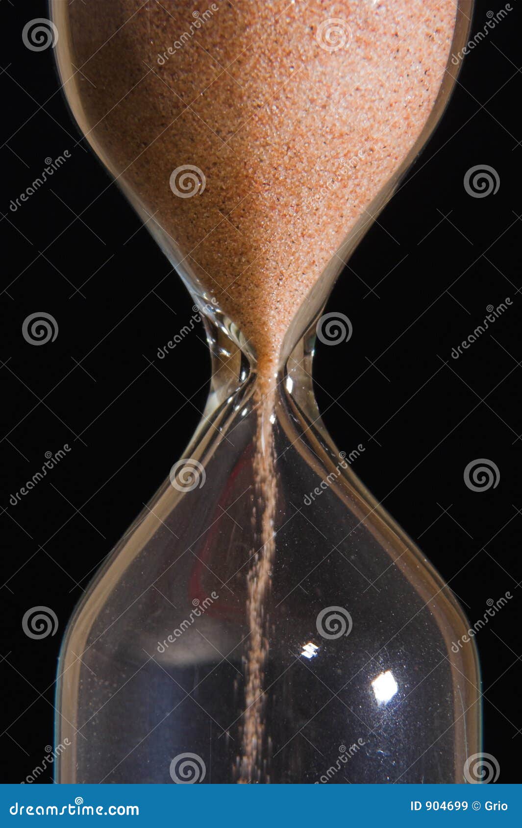 Sandglass With Female Hand Holding Pencil Stock Photography