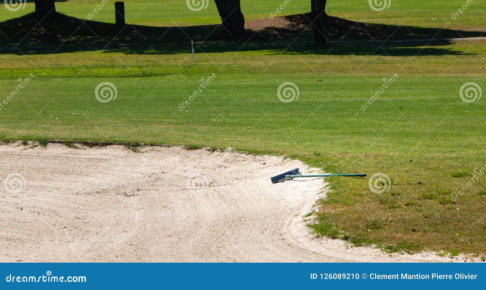 Sand Rake Lying in a Bunker on a Golf Course Stock Photo Image of