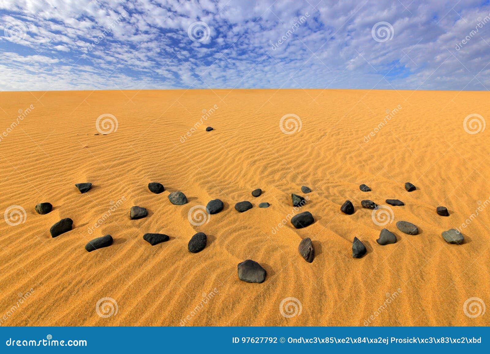 sand waves in the wild nature. dunas maspalomas, gran canaria, spain. yellow sand. sand desert with beautiful rare blue sky with w