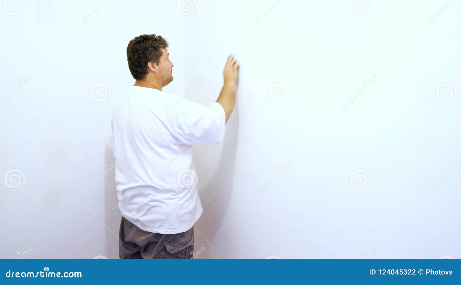 Sanding The Wall Plaster Between Plaster Panels On The Wall Stock