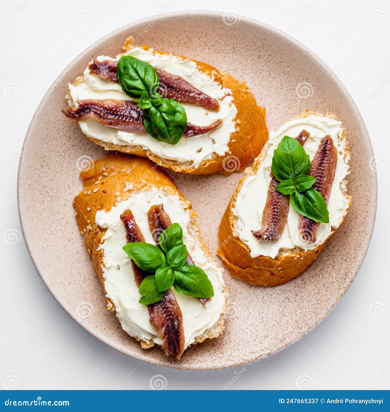 Sandwich with Anchovy Fillets on a Serving Tray on a White Background