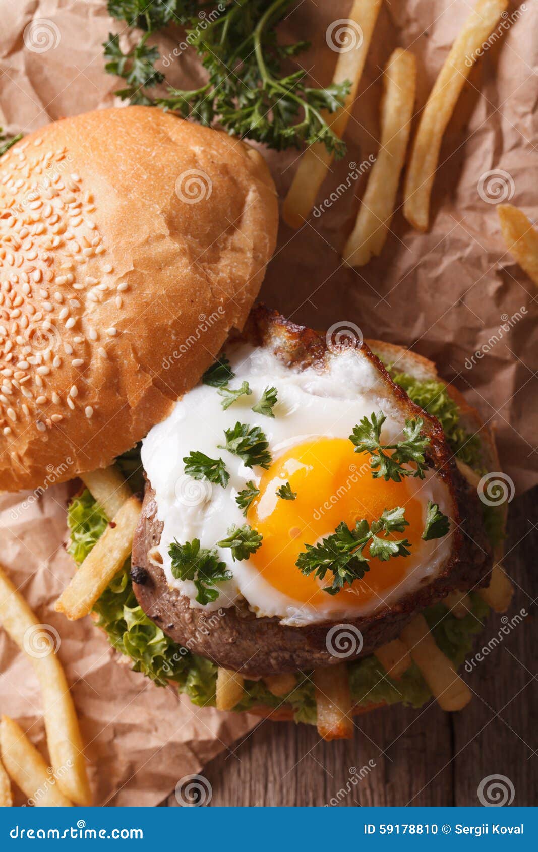 Sandwich with Meat, a Fried Egg and Fries Close-up. Vertical Top Stock ...